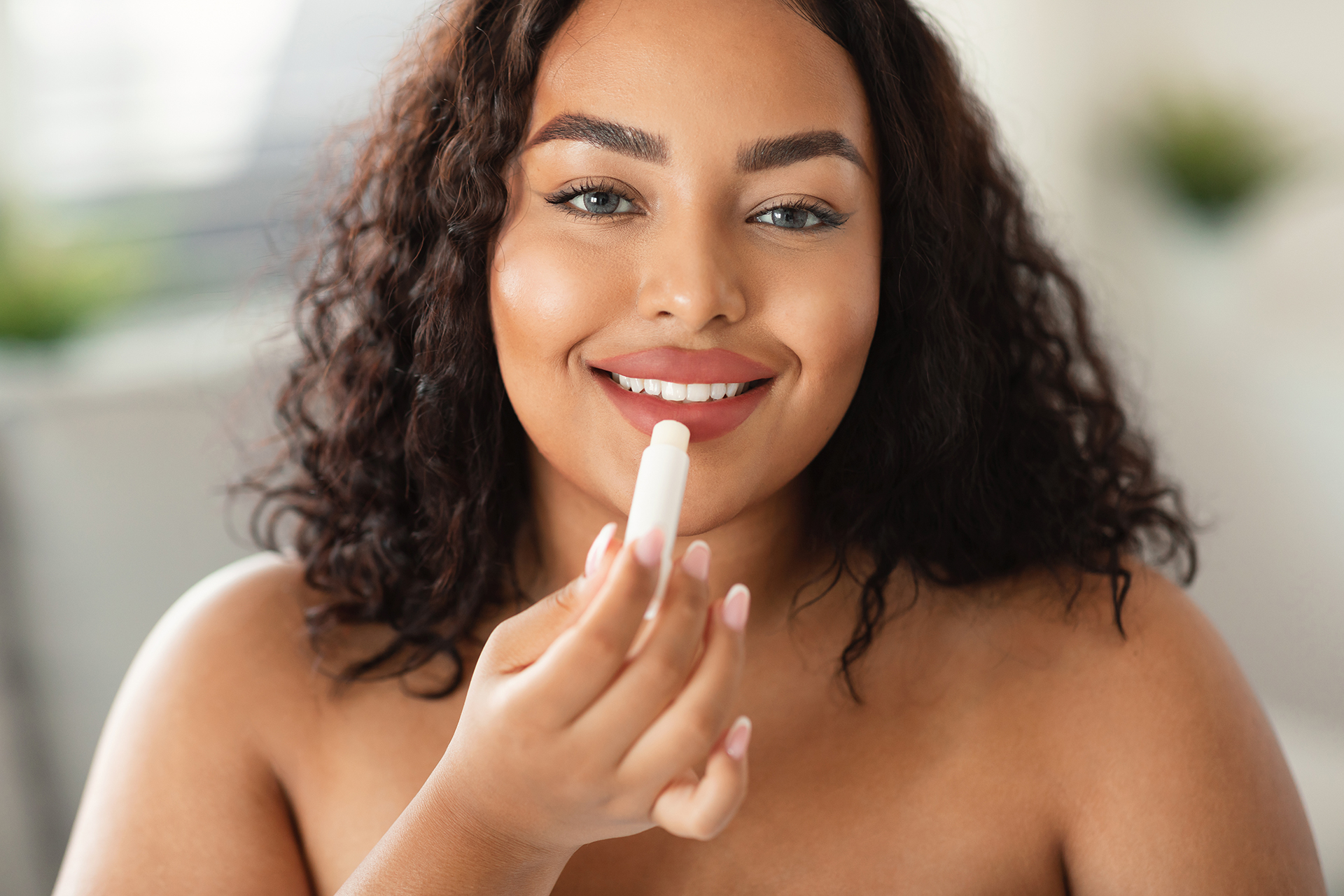 Woman Applying Stick Lip Balm